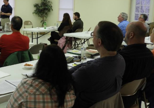 group in conference room during a training session